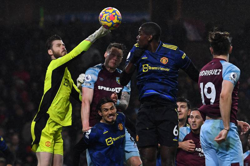 Manchester United keeper David de Gea punches the ball clear under pressure. AFP