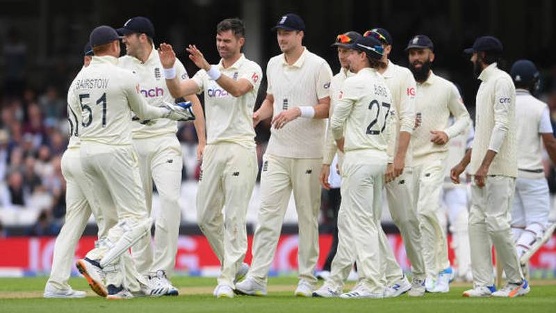 England bowler Jimmy Anderson celebrates with teammates after dismissing Cheteshwar Pujara. Getty