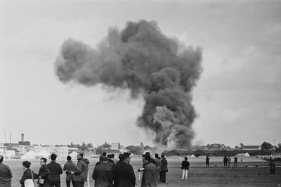 Smoke rises after a French Navy long-range maritime patrol Breguet 1150 Atlantic aircraft crashed into buildings at the Farnborough Airshow in 1968. Five crewmen were killed.