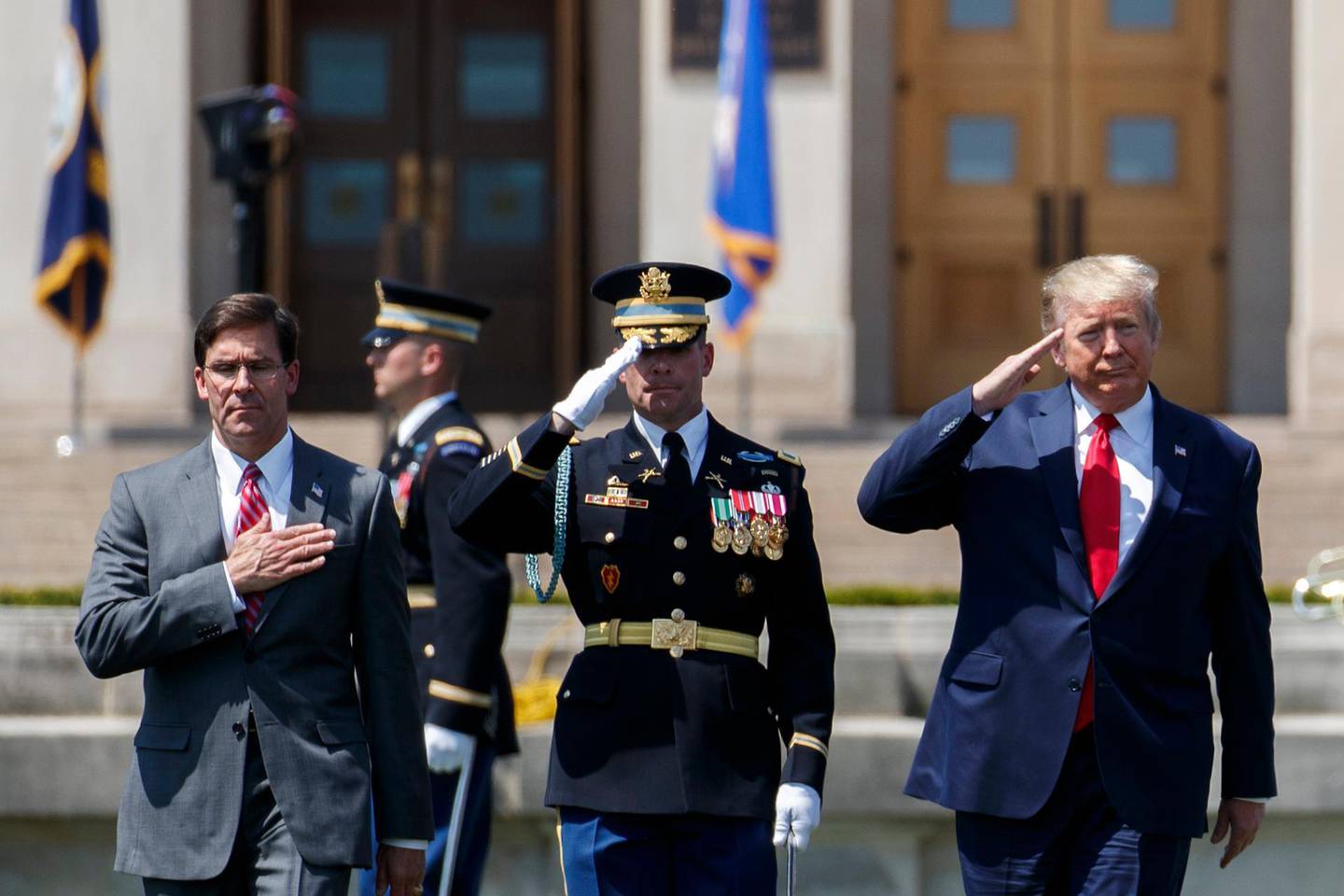 epa07740378 US President Donald J. Trump (R) and Secretary of Defense Mark Esper (L) participate in a full honors welcome ceremony at the Pentagon in Arlington, Virginia, USA, 25 July 2019.  EPA/SHAWN THEW   ALTERNATIVE CROP