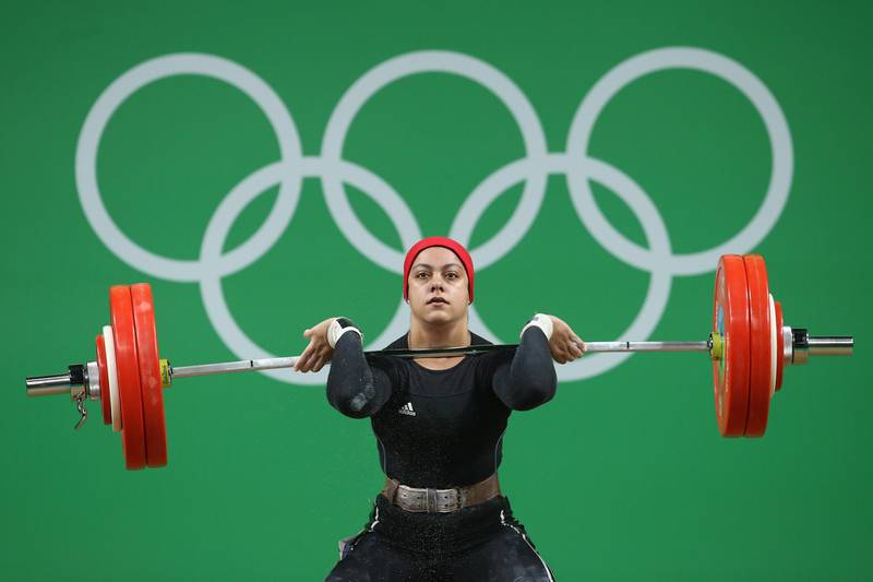 RIO DE JANEIRO, BRAZIL - AUGUST 10:  Sara Ahmed of Egypt lifts during the Women's 69kg Group A weightlifting contest on Day 5 of the Rio 2016 Olympic Games at Riocentro - Pavilion 2 on August 10, 2016 in Rio de Janeiro, Brazil.  (Photo by Julian Finney/Getty Images)