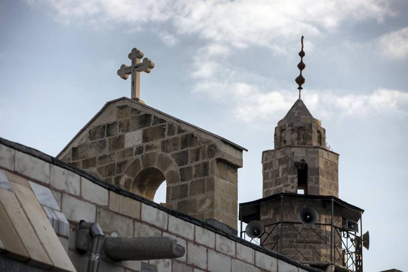 A mosque is seen next to the Greek Orthodox  Church of Saint Porphyrius that dates back to the 12 century in Gaza City on December 23,2018.(Photo by Heidi Levine for The National).