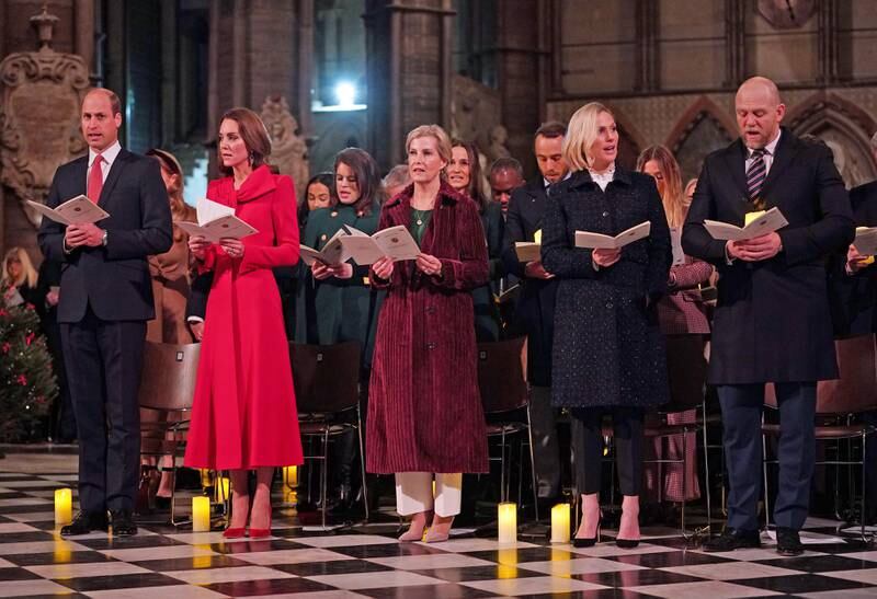 Prince William, Duke of Cambridge; Catherine, Duchess of Cambridge; Sophie, Countess of Wessex, in a Victoria Beckha belted cotton-velvet trench coat; and Zara and Mike Tindall take part in 'Royal Carols - Together At Christmas', a Christmas carol concert hosted by the duchess at Westminster Abbey in London on December 8, 2021 in London, England. Getty Images 