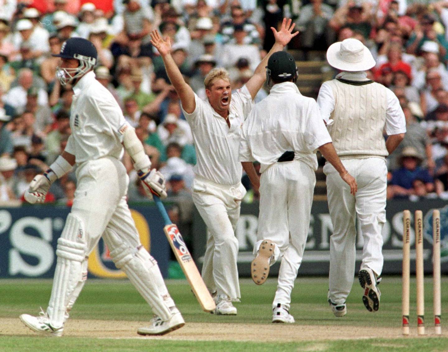 Australian bowler Shane Warne celebrates bowling England's Alec Stewart at Old Trafford in 1997. PA
