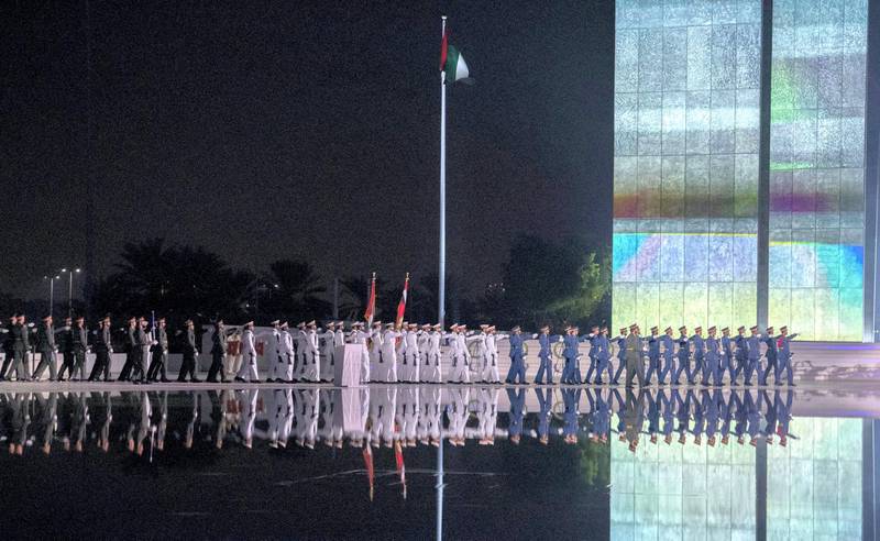 ABU DHABI, UNITED ARAB EMIRATES - November 30, 2019: Members of the UAE Armed Forces participate in a Commemoration Day ceremony at Wahat Al Karama, a memorial dedicated to the memory of UAE’s National Heroes in honour of their sacrifice and in recognition of their heroism.( Eissa Al Hammadi for Ministry of Presidential Affairs )---