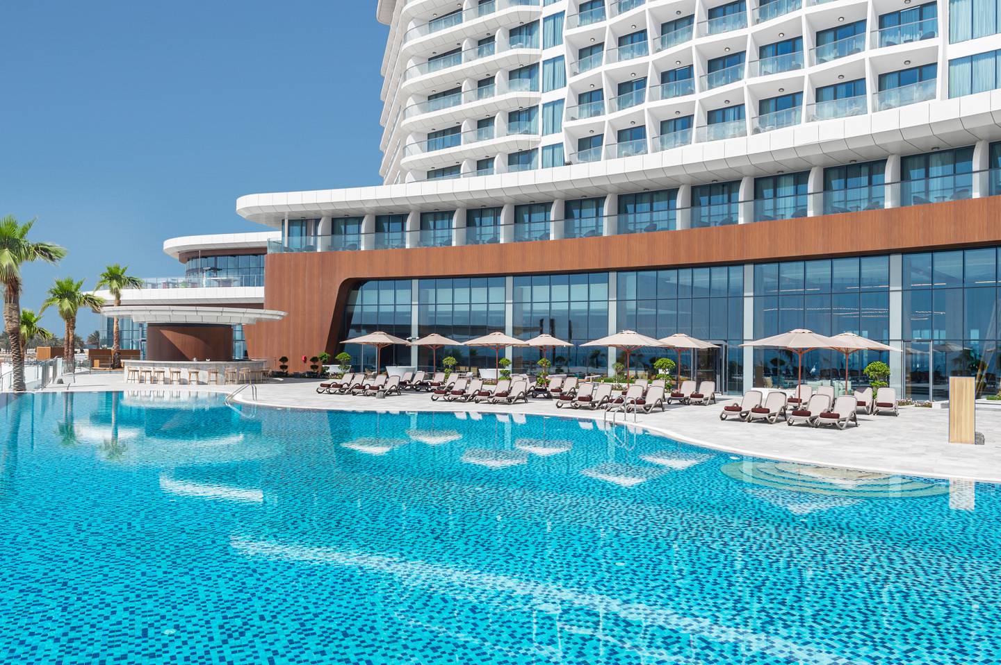 The newly opened Hampton by Hilton Marjan Island in Ras Al Khaimah has a large infinity pool overlooking the Arabian Gulf. Hilton
