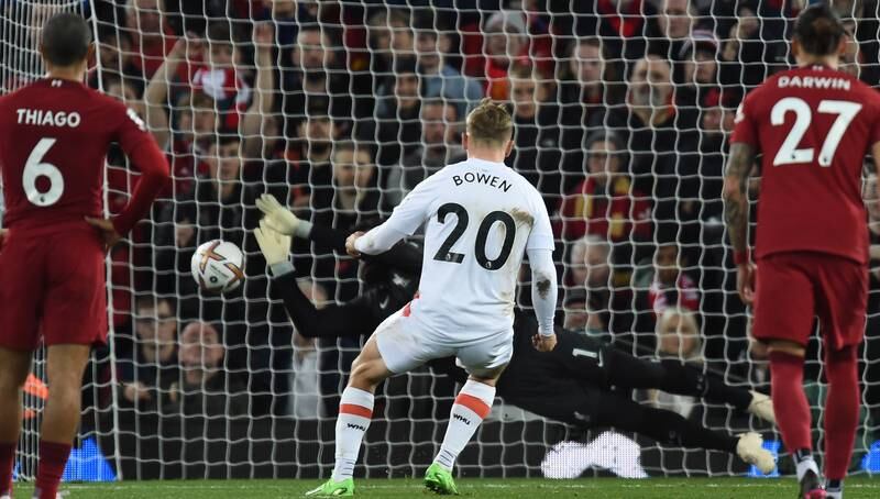 Liverpool goalkeeper Alisson saves Jarrod Bowen's penalty in first half. EPA