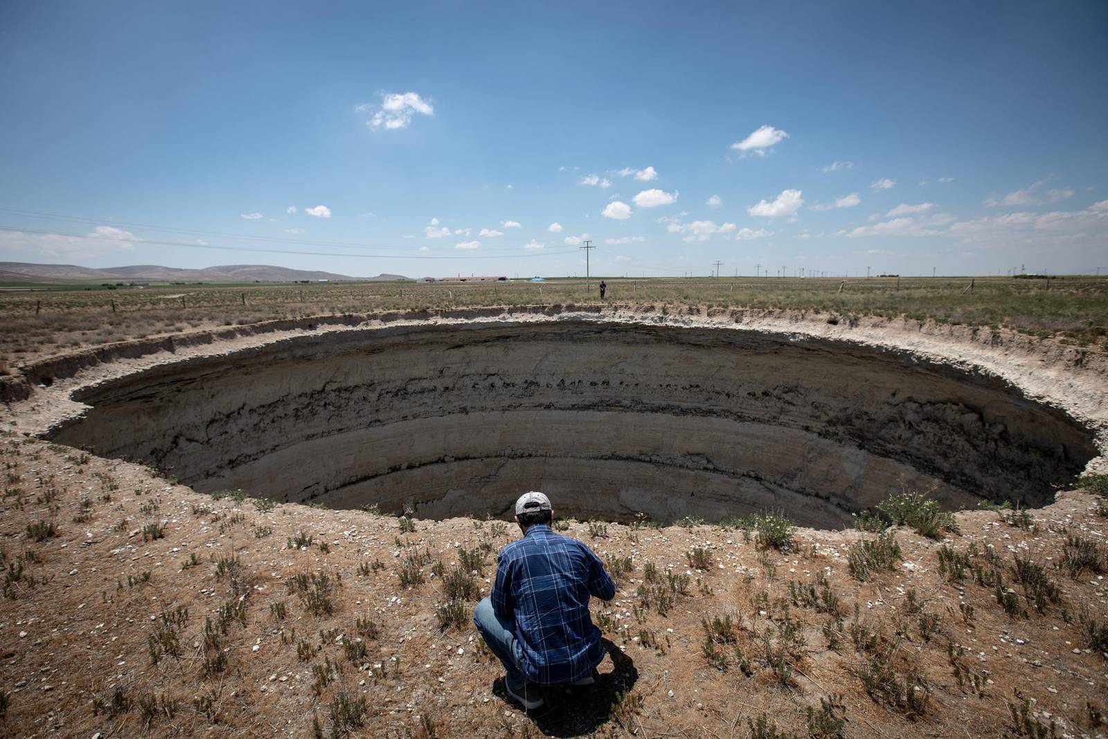 Giant sinkholes dot the landscape in Turkey's Karapinar in pictures