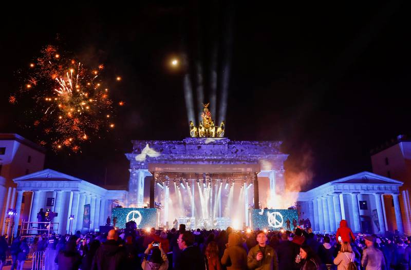Fireworks explode behind the Brandenburg Gate ahead of the New Year, in Berlin, on December 31, 2022. Reuters