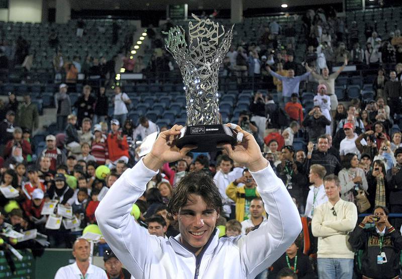 Rafael Nadal of Spain holds his trophy after winning the final match against Robin Soderling of Sweden at the 250,000-dollar Capitala World Tennis Championship at Abu Dhabi's International Tennis Compelx in Zayed Sports City on January 2, 2010. AFP PHOTO/KARIM SAHIB (Photo by KARIM SAHIB / AFP)
