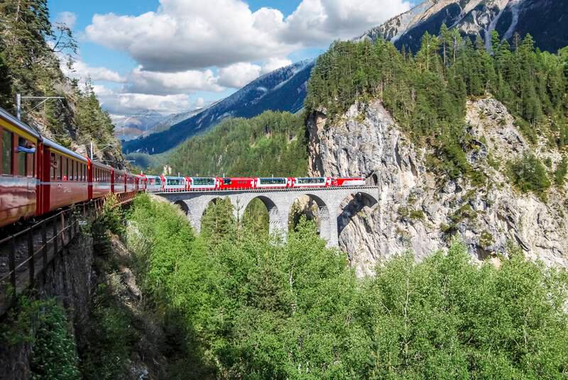 Switzerland's Glacier Express covers the scenic route between two Alpine ski resorts, Zermatt and St Moritz. Getty Images
