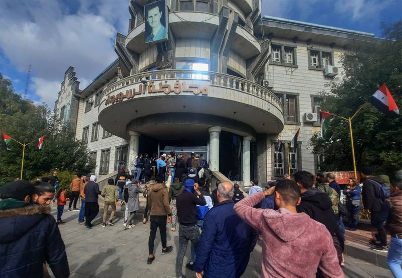 Demonstrators rallying to protest against deteriorating living conditions in front of the Sweida governorate building in the southern Syrian city. AFP