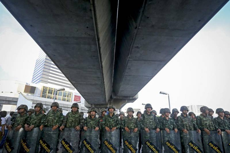 Thai soldiers block access to a section of an overpass during a protest against the military coup in Bangkok on Saturday. Diego Azubel / AFP