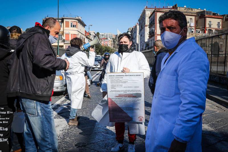 Doctors of the San Gennaro hospital protest and briefly block a road calling for the redevelopment of the hospital and the reopening of the emergency room in Naples, Italy. EPA