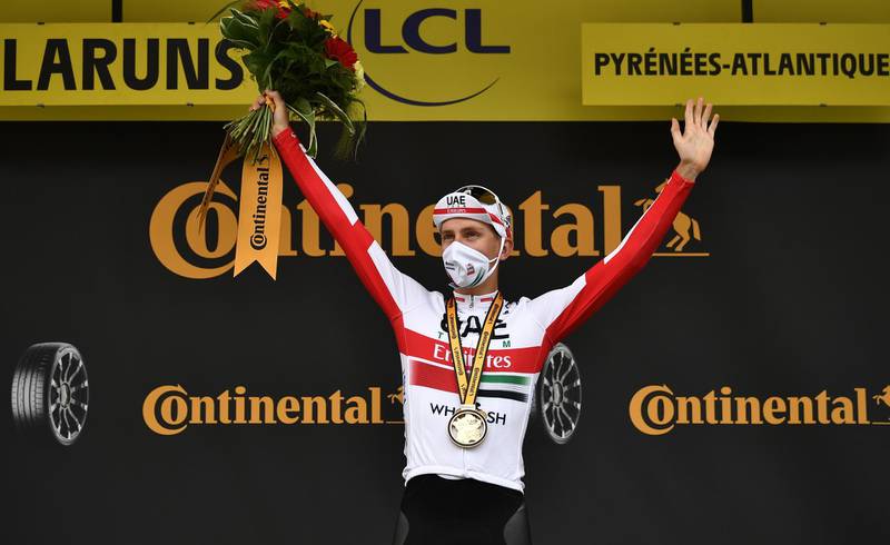 Slovenian rider Tadej Pogacar of UAE Team Emirates celebrates his stage victory after the ninth stage of the Tour de France on September 6. EPA