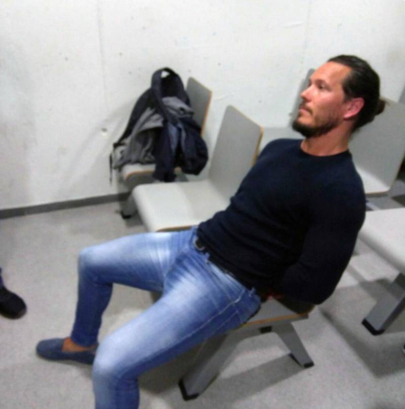 In this photo released Saturday May 5, 2018, by the UK National Crime Agency announcing the capture of one of Britain's most wanted fugitives Jamie Acourt, who was detained in Barcelona, Spain, in joint operation carried out by UK and Spanish police.  A statement from UK National Crime Agency, says Acourt was detained on a European Arrest Warrant and â€œis believed to be involved in the large-scale supply of drugs.â€ (UK National Crime Agency via AP)