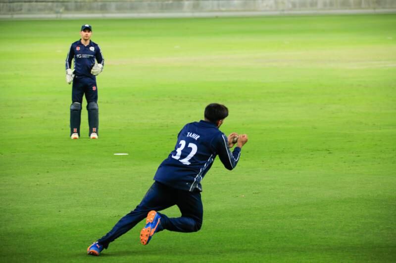 Hamza Tahir takes the match-winning catch for Scotland against Oman. Photo: ICC