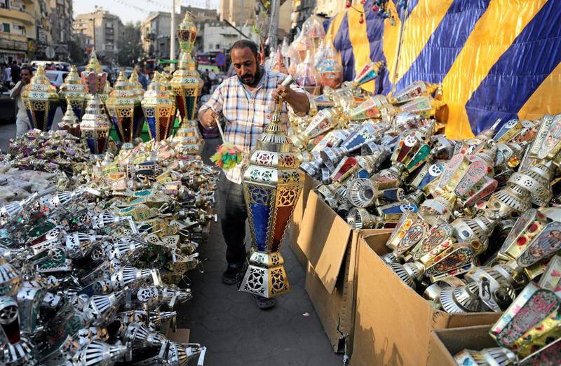 An Egyptian seller dusts a traditional Ramadan lantern called "fanous" at his shop stall ahead of the Muslim holy month of Ramadan in Cairo, Egypt May 24, 2017. Mohamed Abd El Ghany/Reuters