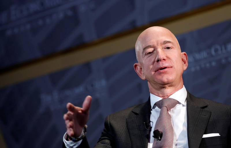 FILE PHOTO: Jeff Bezos, president and CEO of Amazon and owner of The Washington Post, speaks at the Economic Club of Washington DC's "Milestone Celebration Dinner" in Washington, U.S., September 13, 2018.      REUTERS/Joshua Roberts/File Photo    To match Special Report AMAZON-INDIA/OPERATION