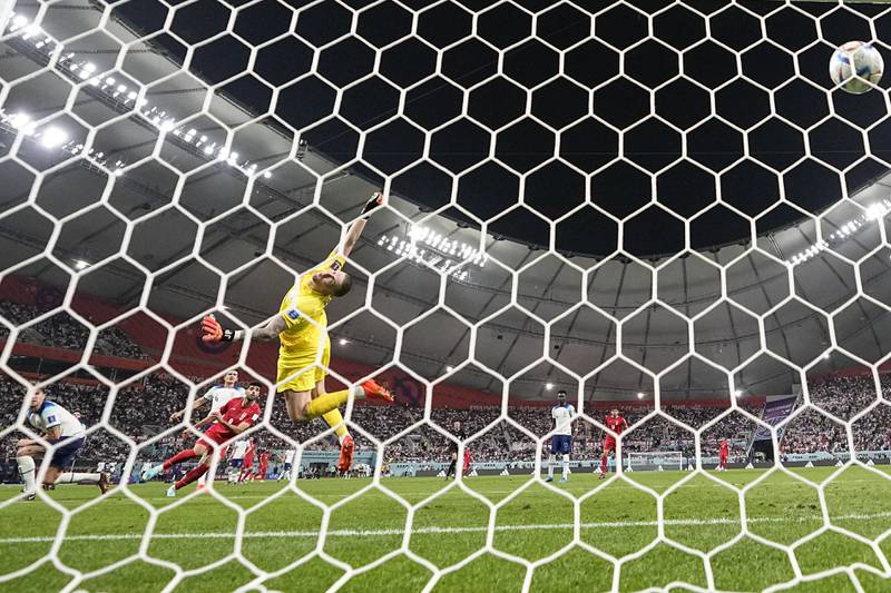 Iran's Mehdi Taremi scores his first of two goals against England during their opening World Cup game. AP Photo