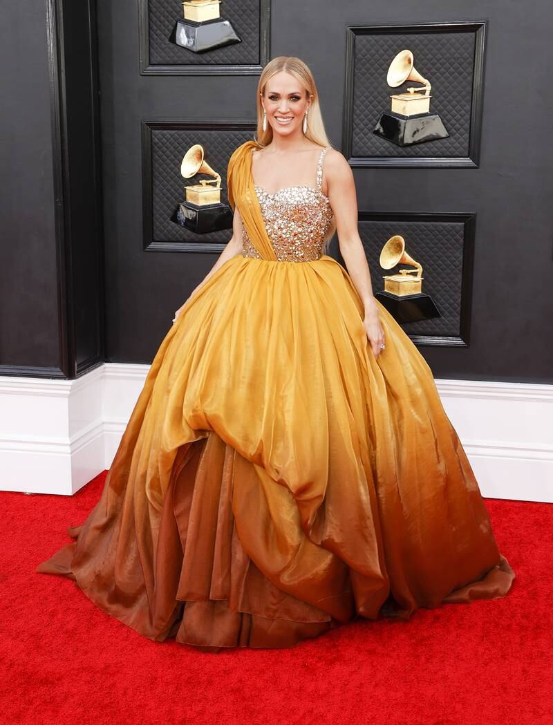 Carrie Underwood, wearing a yellow gown. EPA