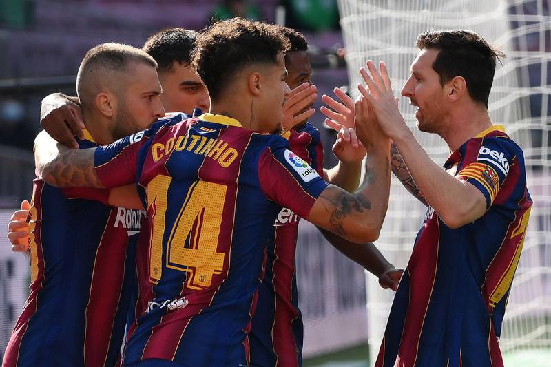 Lionel Messi, right, celebrates with Barca teammates after Ansu Fati's goal. AFP
