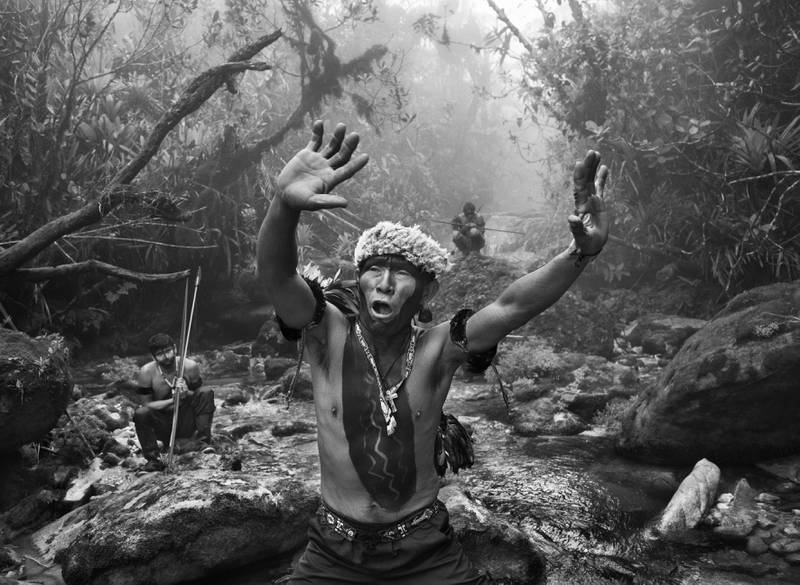 A Yanomani shaman interacts with spirits during an ascent to the Pico da Neblina, State of Amazonas, Brazil, 2014. It is one of the images by Salgado as part of the new exhibition Amazonia. Sebastiao Salgado / nbpictures