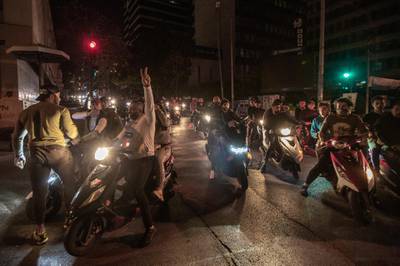 Anti-government protesters ride their motorcycles during a protest against the collapsing Lebanese currency and the price hikes of goods, in front the central bank in Beirut, Lebanon.  EPA