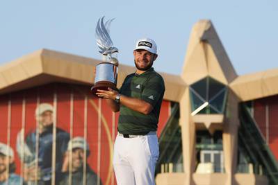 ABU DHABI, UNITED ARAB EMIRATES - JANUARY 24: Tyrrell Hatton of England celebrates with the trophy following victory during Day 4 of the Abu Dhabi HSBC Championship at Abu Dhabi Golf Club on January 24, 2021 in Abu Dhabi, United Arab Emirates. (Photo by Ross Kinnaird/Getty Images)