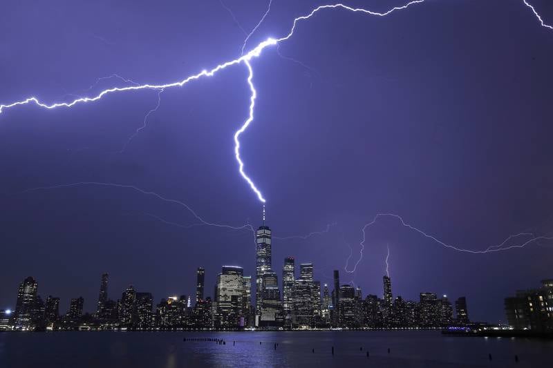 Lightning strikes One World Trade Centre in New York City during a thunderstorm as seen from Jersey City, New Jersey. Getty Images