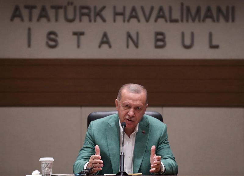 Turkish President Recep Tayyip Erdogan speaks to the media, in Istanbul, Saturday, Sept. 21, 2019. Erdogan expressed frustration with what he said was the United States' continued support to Syrian Kurdish forces that Turkey regards as terrorists and reiterated that Turkey had completed all preparations for a possible unilateral military operation in northeast Syria, along the Turkish border east of the Euphrates River.(Presidential Press Service via AP, Pool)