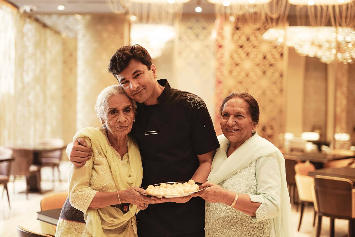 Chef Vikas Khanna with his mother, right, and grandmother at Kinara in Dubai
