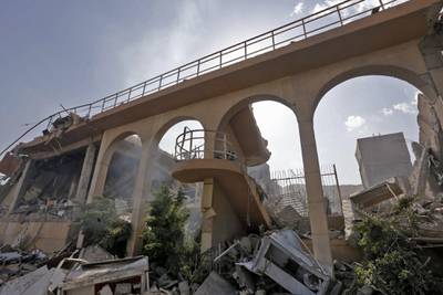 This picture taken on April 14, 2018 shows the wreckage of a building described as part of the Scientific Studies and Research Centre (SSRC) compound in the Barzeh district, north of Damascus, during a press tour organised by the Syrian information ministry.
The United States, Britain and France launched strikes against Syrian President Bashar al-Assad's regime early on April 14 in response to an alleged chemical weapons attack after mulling military action for nearly a week. Syrian state news agency SANA reported several missiles hit a research centre in Barzeh, north of Damascus, "destroying a building that included scientific labs and a training centre". AFP PHOTO / LOUAI BESHARA