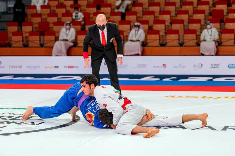 Omar Al Fadhli (in white) has Macley Silva pinned in the 62-kilogram purple belt final at the Abu Dhabi World Professional Jiu-Jitsu Championship at the Jiu-Jitsu Arena on Thursday, April 8, 2021. Courtesy UAEJJF