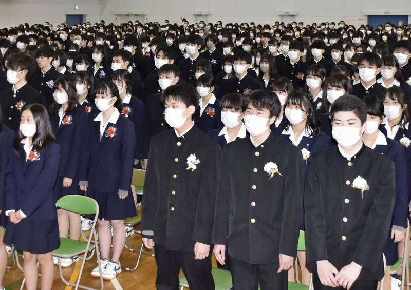Students wear masks amid concerns about the new coronavirus during their graduation ceremony at Koyo Senior High School in Nagoya, Japan. Reuters