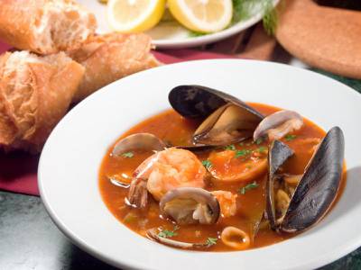 How about a little something from the sea to warm your insides... A robust stew, similar to a bouillabaisse, features a variety of the sea's edible treasures such as baby manila clams, mussels, prawns, calamari, sea bass, and crab in a rich tomato base. (iStockphoto.com)