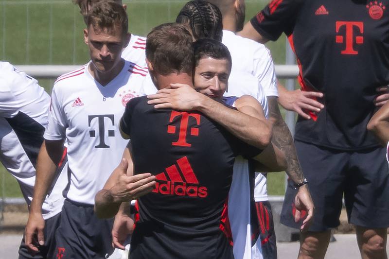 Robert Lewandowski and Bayern Munich coach Julian Nagelsmann say goodbye at the end of training in Munich, on Saturday, July 16, 2022.  AP
