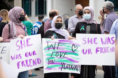 Friend's of Yumnah Afzaal, 15, who died in the attack along with her parents and grandmother, gather at the vigil. AFP