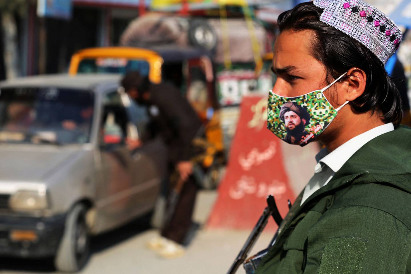 A member of the Taliban at a checkpoint along a street in Jalalabad on Tuesday. AFP