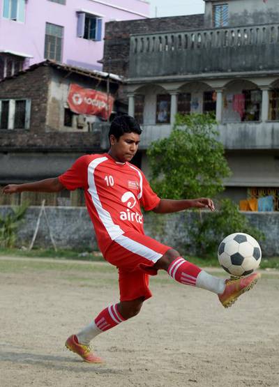 Arka Dey's father died after a battle with cancer three years ago. Dey wants to honour him with a football career. 'My father was a fan of Brazilian star Pele. He was my first coach,' he said. Dibvangshu Sarkar / AFP