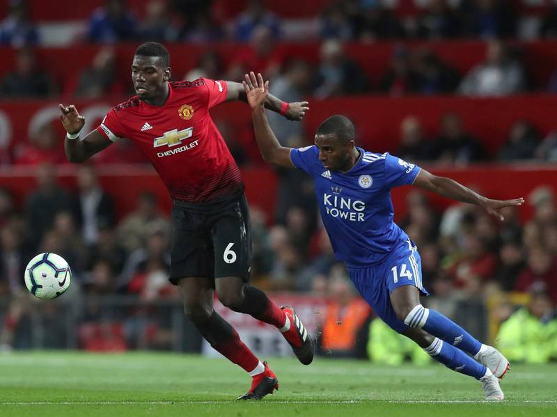 Manchester United's Paul Pogba holds off a challenge from Leicester City's Ricardo Pereira. AP Photo