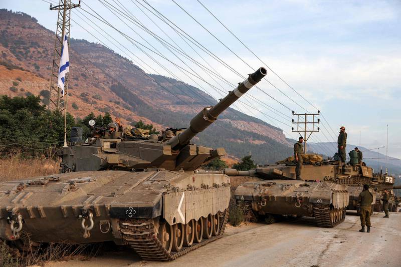 A column of Israeli Merkava battle tanks likely equipped with Trophy. AFP