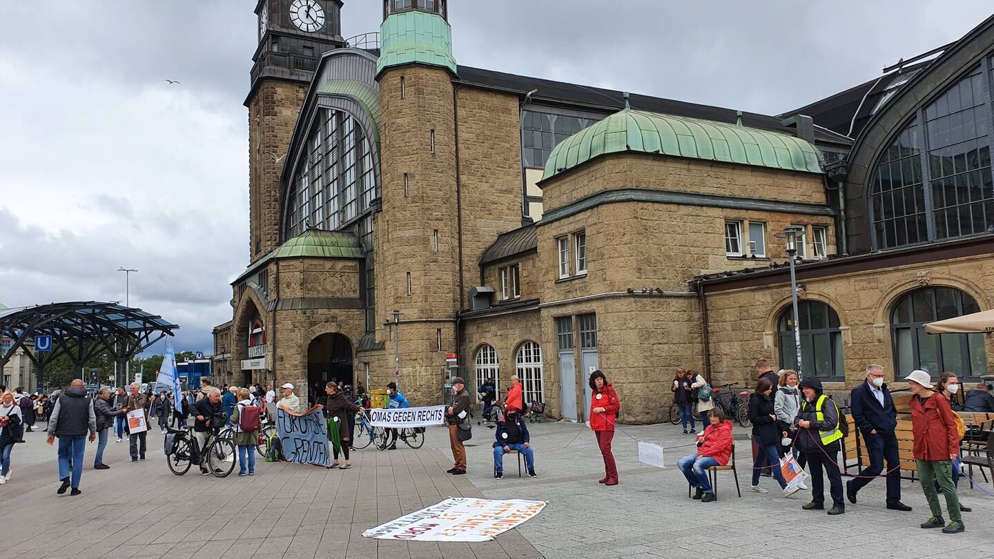Activists form a human chain in support of refugees outside Hamburg's central station. Tim Stickings / The National