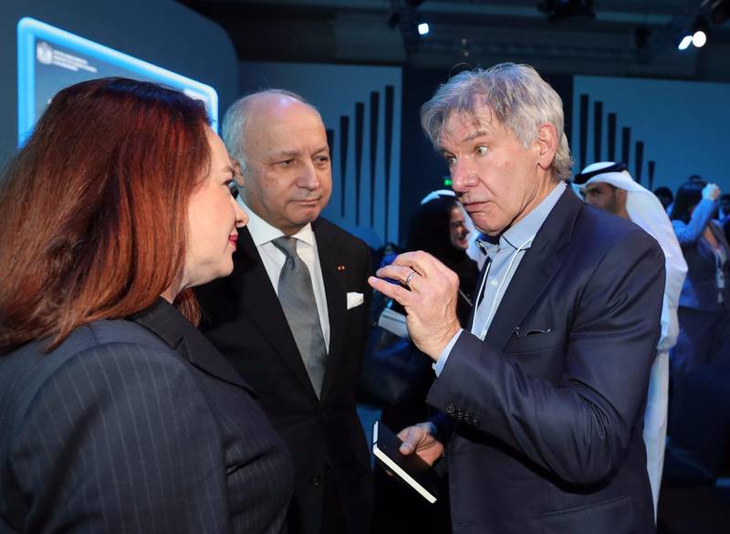 Harrison Ford speaks to the UN General Assembly President María Fernanda Espinosa on Monday. Chris Whiteoak / The National