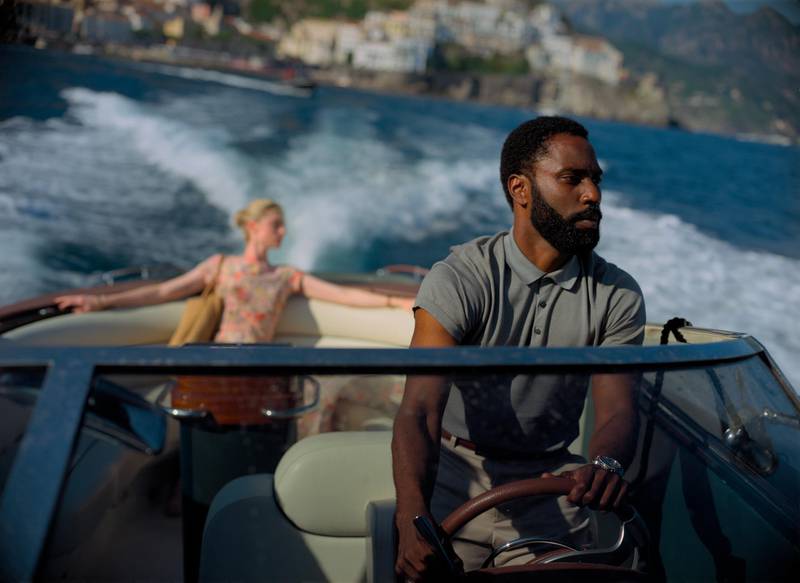 This image released by Warner Bros. Entertainment shows Elizabeth Debicki, left, and John David Washington in a scene from "Tenet."  The film, which had hoped to herald Hollywoodâ€™s return to big theatrical releases, has yet again postponed its release due to the ongoing coronavirus pandemic. Warner Bros. said Monday that â€œTenetâ€ will not make its August 12 release date. And unlike previous delays, the studio this time didnâ€™t announce a new target for the release of Nolanâ€™s much-anticipated $200 million thriller.  (Melinda Sue Gordon/Warner Bros. Entertainment via AP)