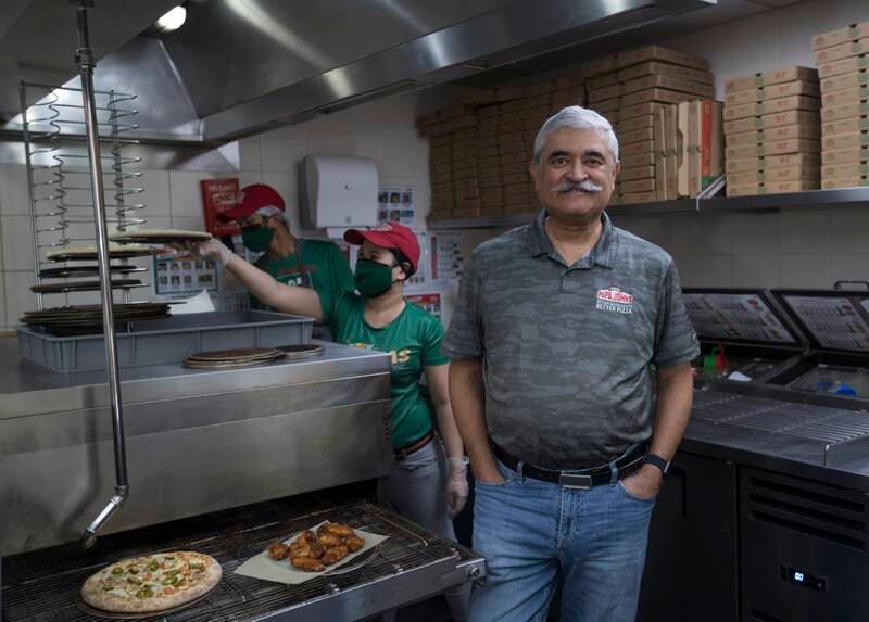 Tapan Vaidya, chief executive of Papa John’s Pizza in the UAE and Saudi Arabia, expects the law change to lead to an influx of job applications from younger people.  Ruel Pableo for The National