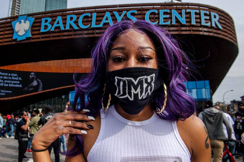 Cherrelle McClary, 32, poses for a portrait with her DMX mask during a memorial at Barclays Centre. AP