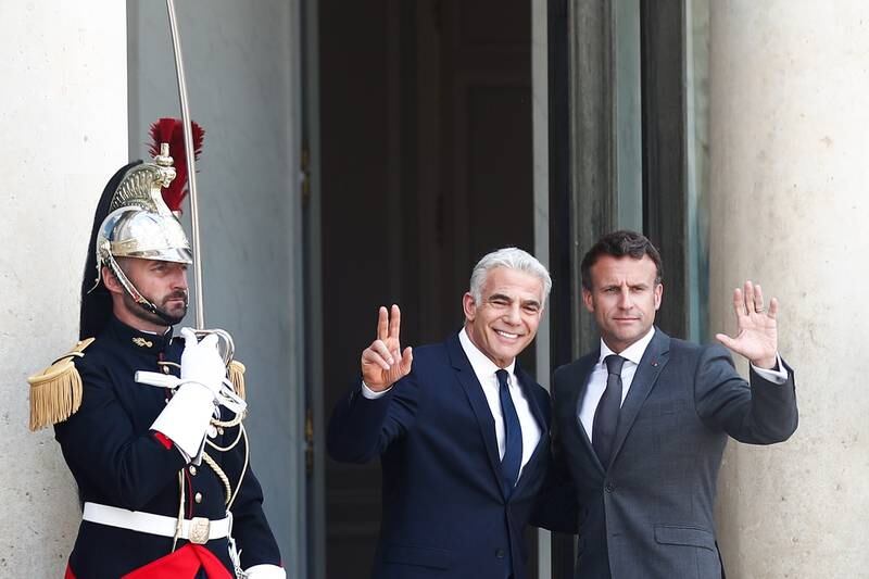 French President Emmanuel Macron, right, and Israeli interim Prime Minister Yair Lapid at Elysee Palace in Paris, on Tuesday.  EPA