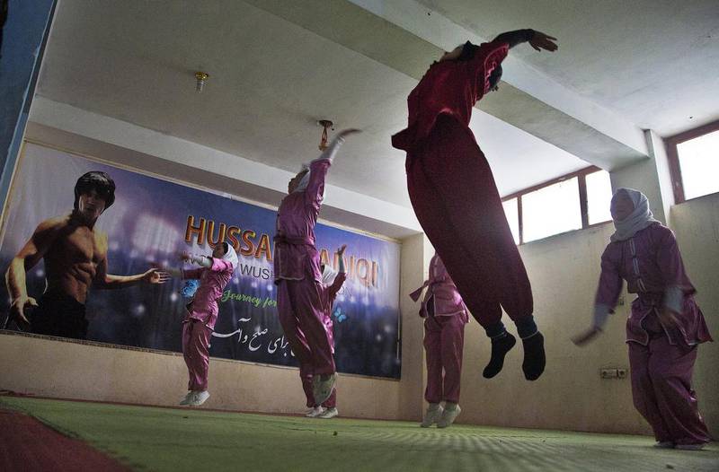 ‘Some of my students’ families had problems accepting their girls studying Wushu (martial arts), says Ms Azimi. ‘But I went to their home and talked to their parents.’ Massoud Hossaini / AP Photos
