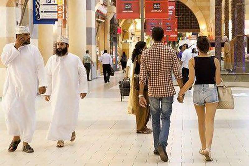 A young couple in Ibn Battuta Mall. A UAE minister told the FNC today that he supports the idea of enforcing a federal law on dress codes in UAE malls. Razan Alzayani / The National